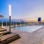 Spacious rooftop pool deck with city view