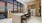 Entertaining kitchen with stainless steel appliances, 4 barstools and indoor / outdoor flow