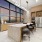 Entertaining kitchen with stainless steel appliances, 4 barstools and indoor / outdoor flow