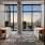 Flexible coworking space with 2 waterfall desks, 4 chairs and large windows overlooking the city