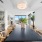 Dining room with dry bar and wine chiller. Dry bar has white counter top with beige color wood cabinets 