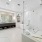 Bathroom photo with dark wood cabinets, marble title flooring== and free standing tub and walkin shower 