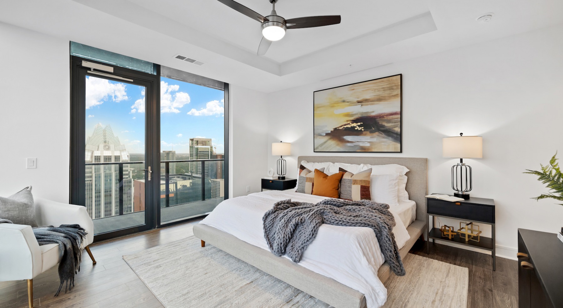 Large well lit bedroom with terrace