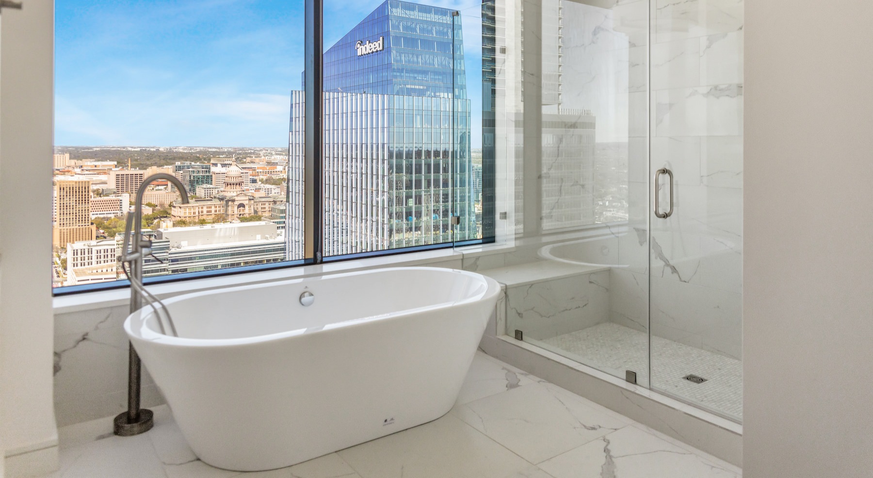 Spacious bathroom with large shower and soaking tub