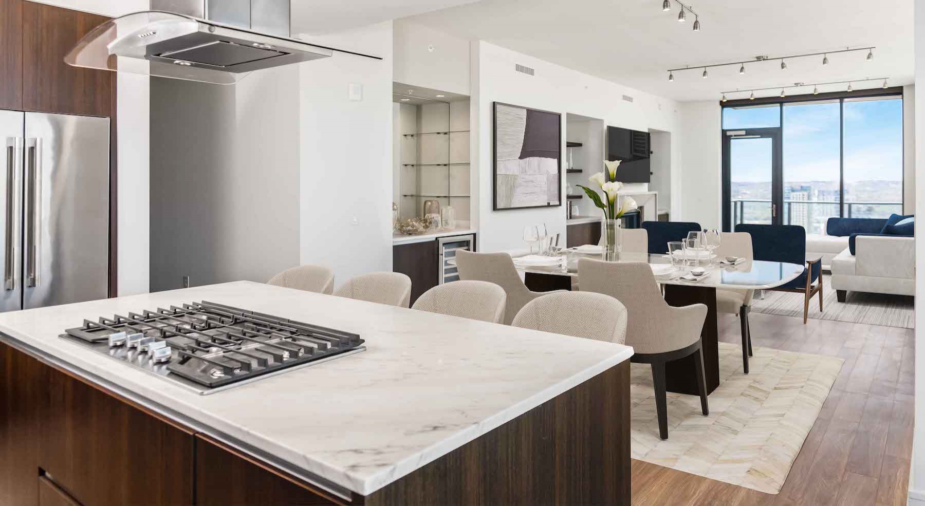 Spacious kitchen with large windows and wood floors