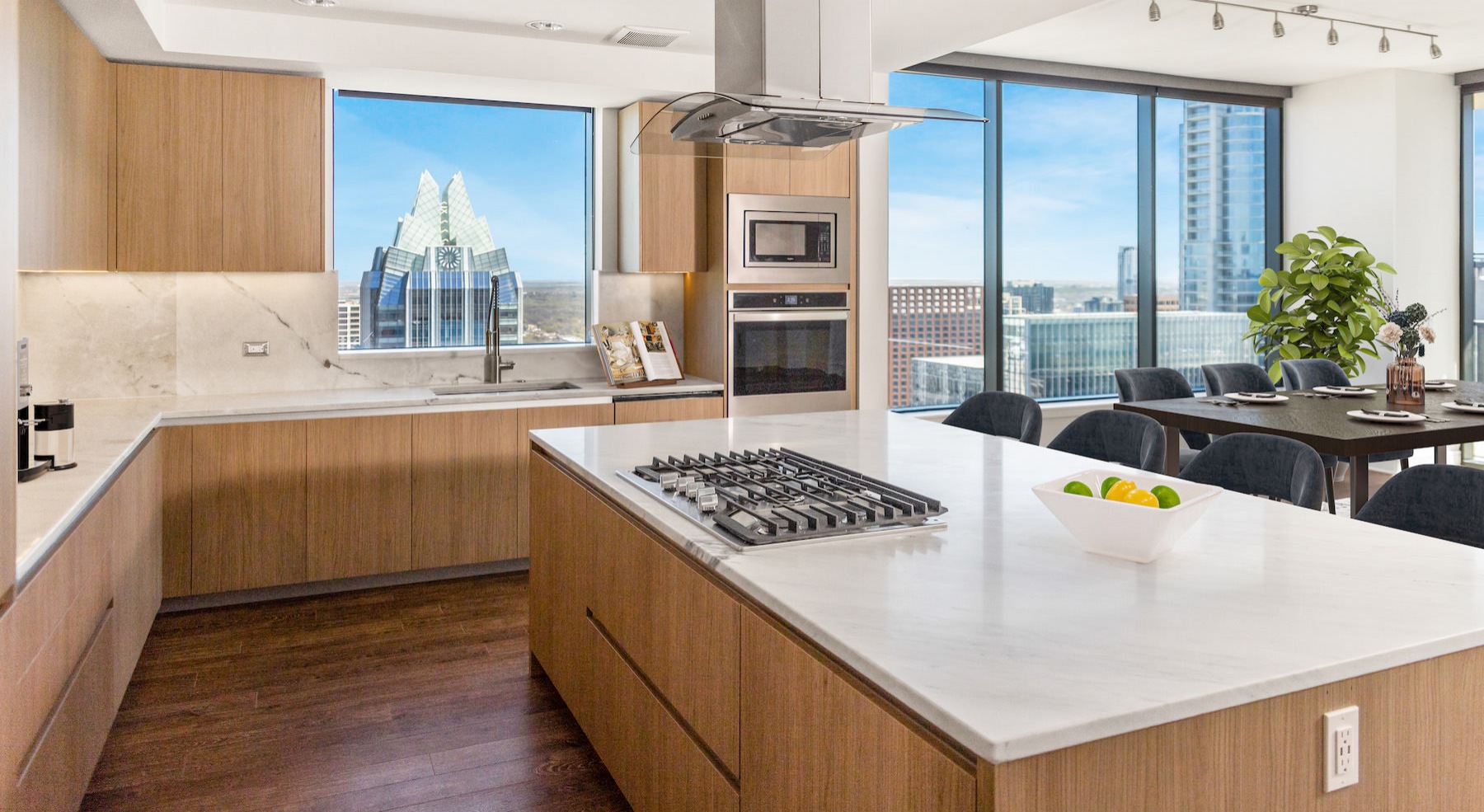 Spacious kitchen with large windows and wood floors
